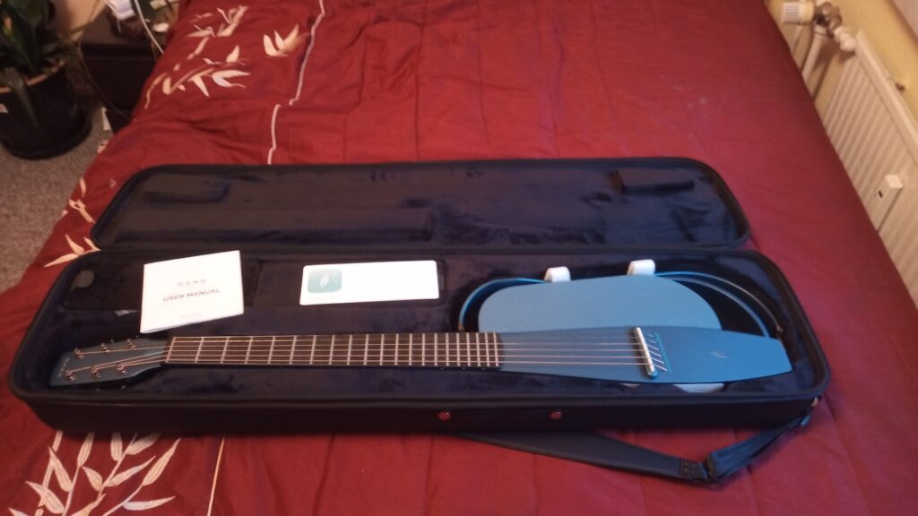 The Enya NEXG, when it is disassembled in its guitar case